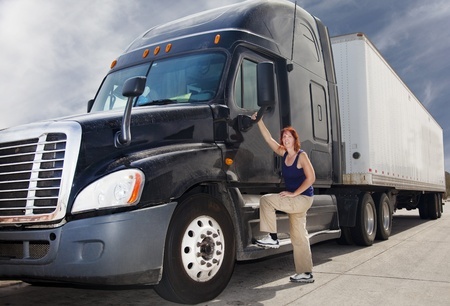 truck driver standing next to truck