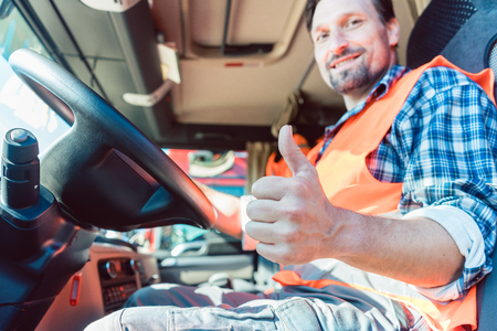 Responsible truck driver giving a thumbs up