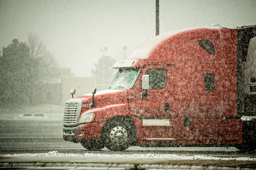 semi truck hauler driving snow