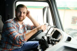Driver behind wheel while taking truck driving school