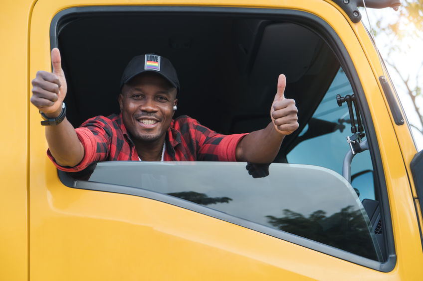 Smiling Truck Driver giving two thumbs up